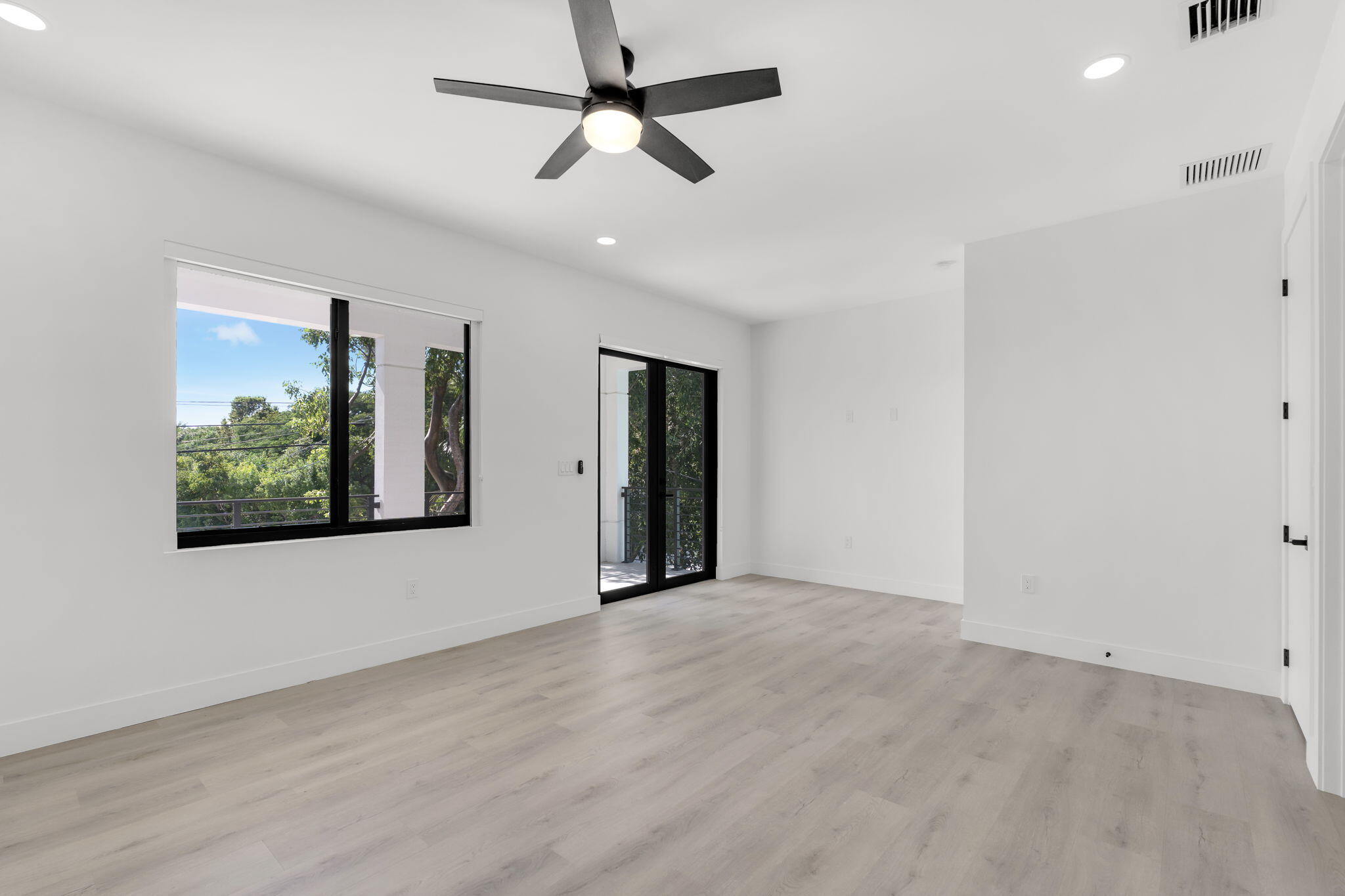 50 Transylvania Avenue Key Largo, FL 33037 - Photo 24 of 59 wooden floor in an empty room with a window