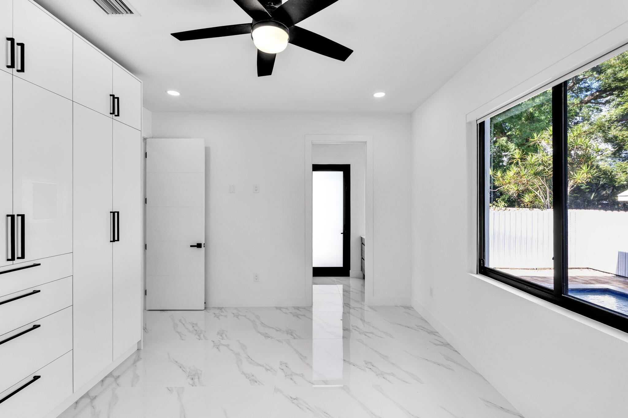 50 Transylvania Avenue Key Largo, FL 33037 - Photo 31 of 59 a view of entryway with a window and a ceiling fan