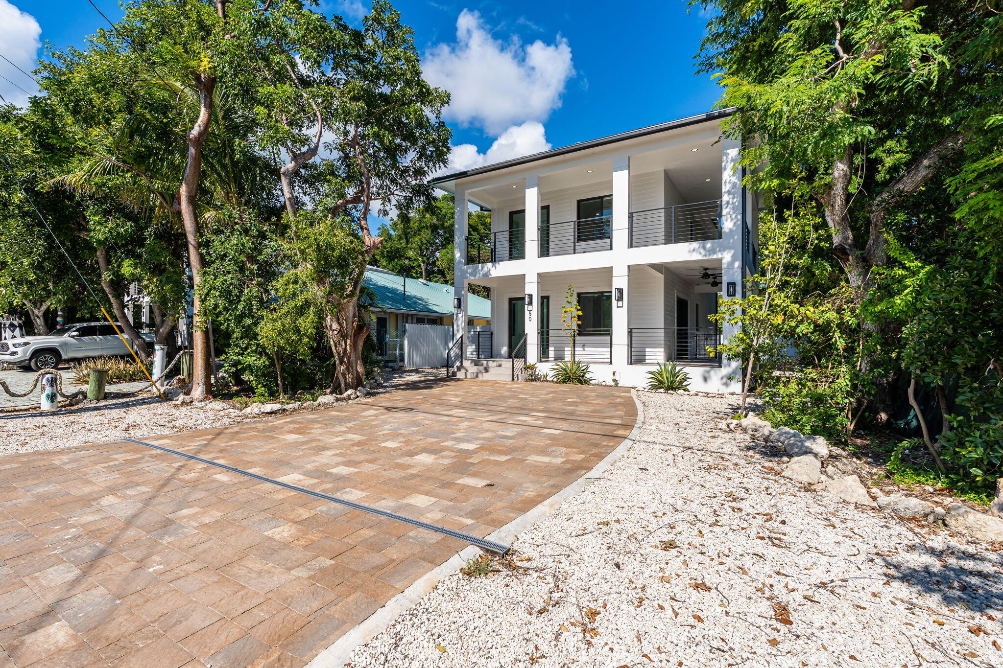 50 Transylvania Avenue Key Largo, FL 33037 - Photo 34 of 59 a front view of a house with a yard
