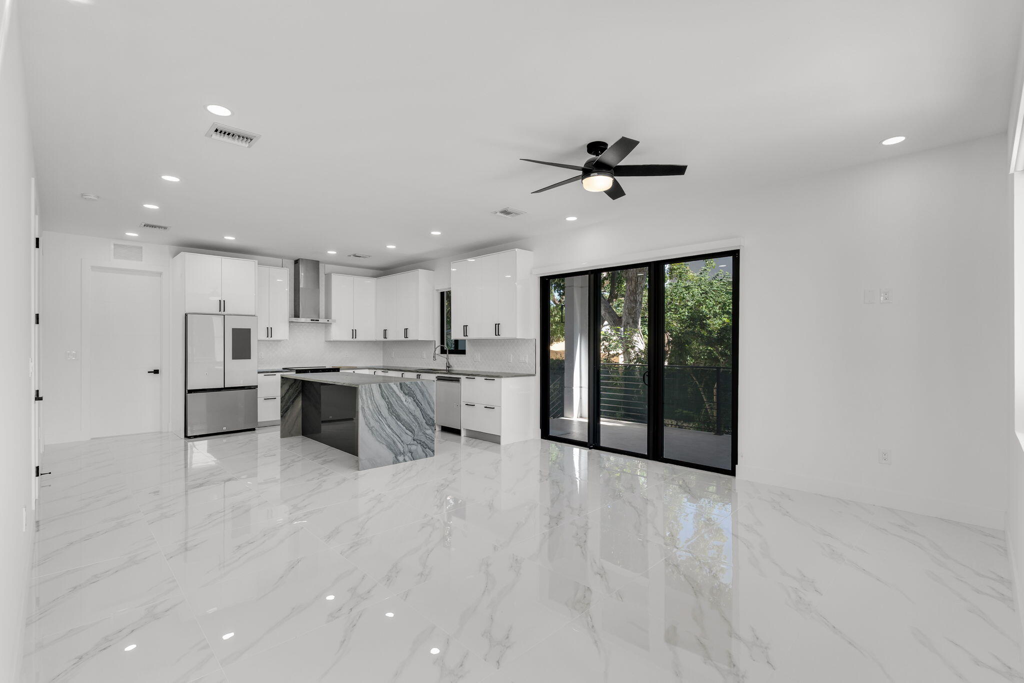 50 Transylvania Avenue Key Largo, FL 33037 - Photo 4 of 59 a view of a kitchen with kitchen island a sink stainless steel appliances and cabinets