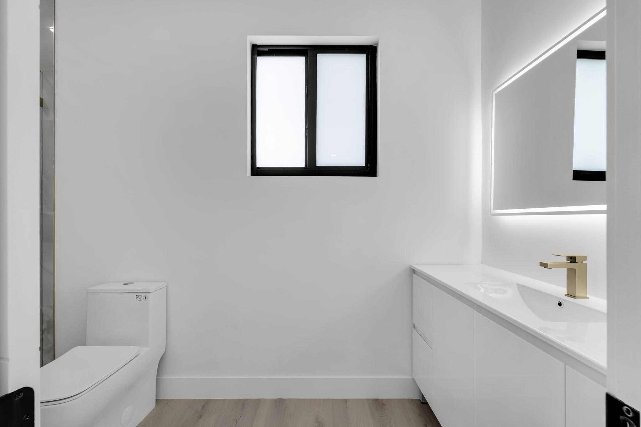 50 Transylvania Avenue Key Largo, FL 33037 - Photo 43 of 59 a bathroom with a sink a toilet and a mirror