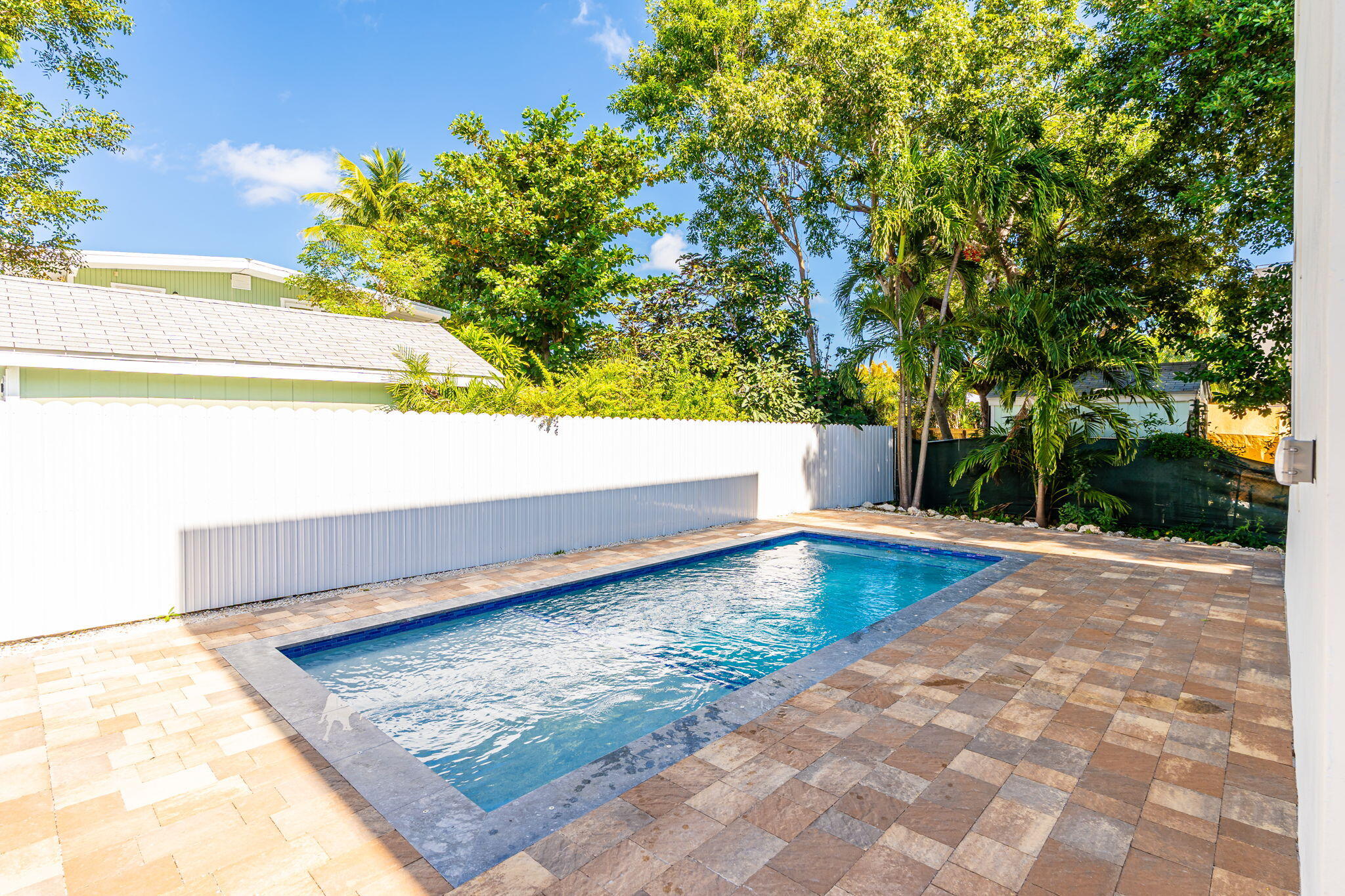 50 Transylvania Avenue Key Largo, FL 33037 - Photo 49 of 59 a view of a swimming pool with a yard