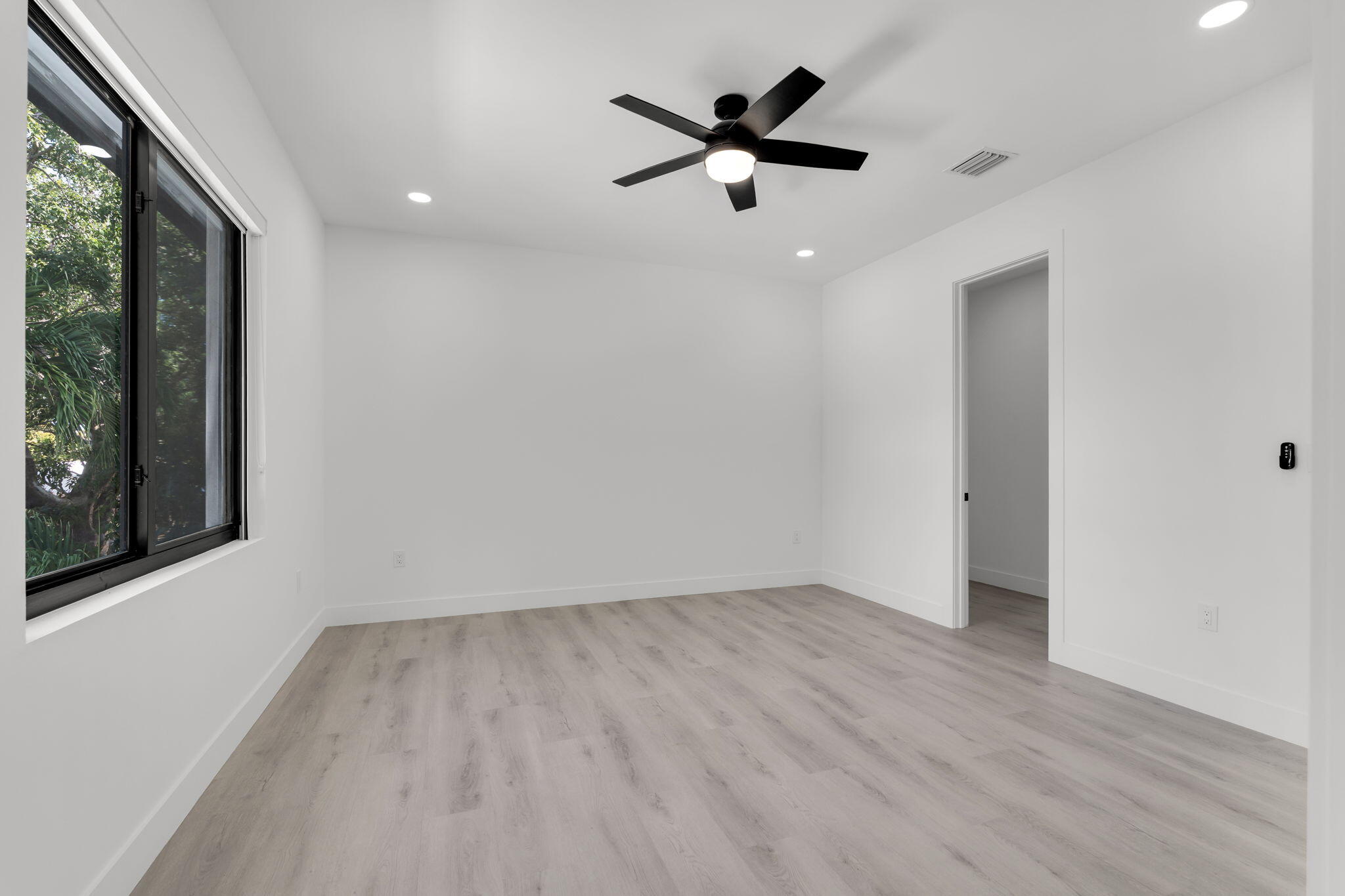 50 Transylvania Avenue Key Largo, FL 33037 - Photo 50 of 59 an empty room with wooden floor and windows