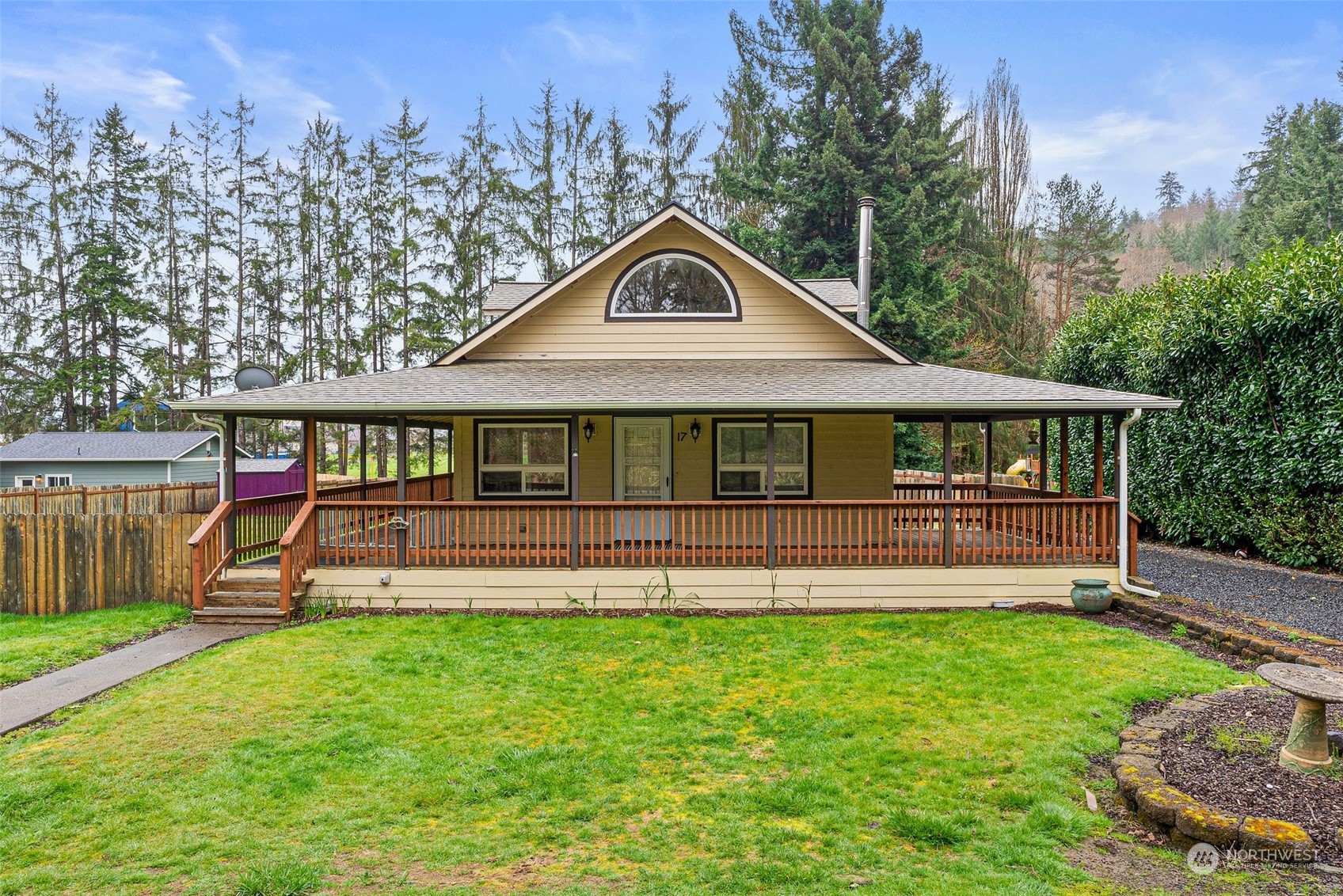 a front view of a house with a yard table and chairs