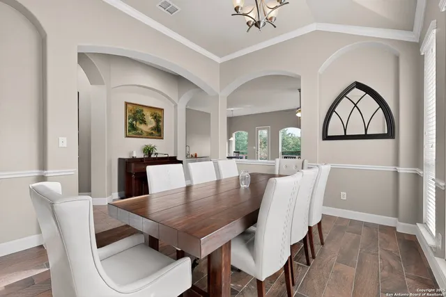 a view of a dining room with furniture and window