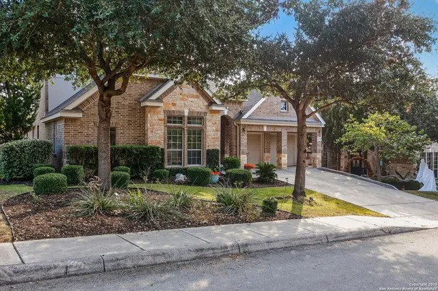 a front view of a house with a yard and porch