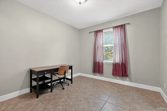 a view of workspace with furniture and window