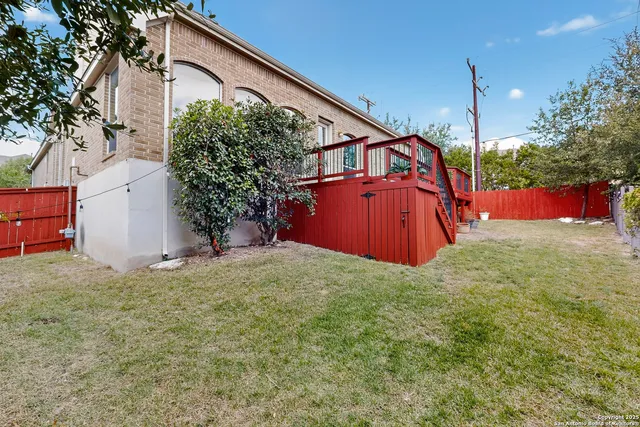 a backyard of a house with yard and garage