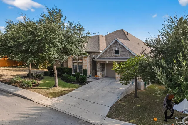 a front view of house with yard and green space