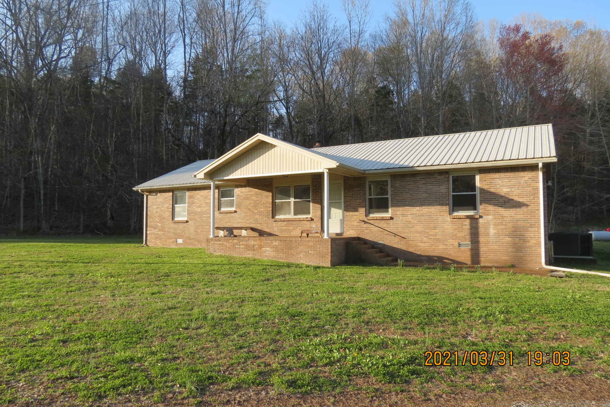 876 Denmark Road Erin, TN 37061 - Photo 2 of 45 a view of a house with a yard and sitting area