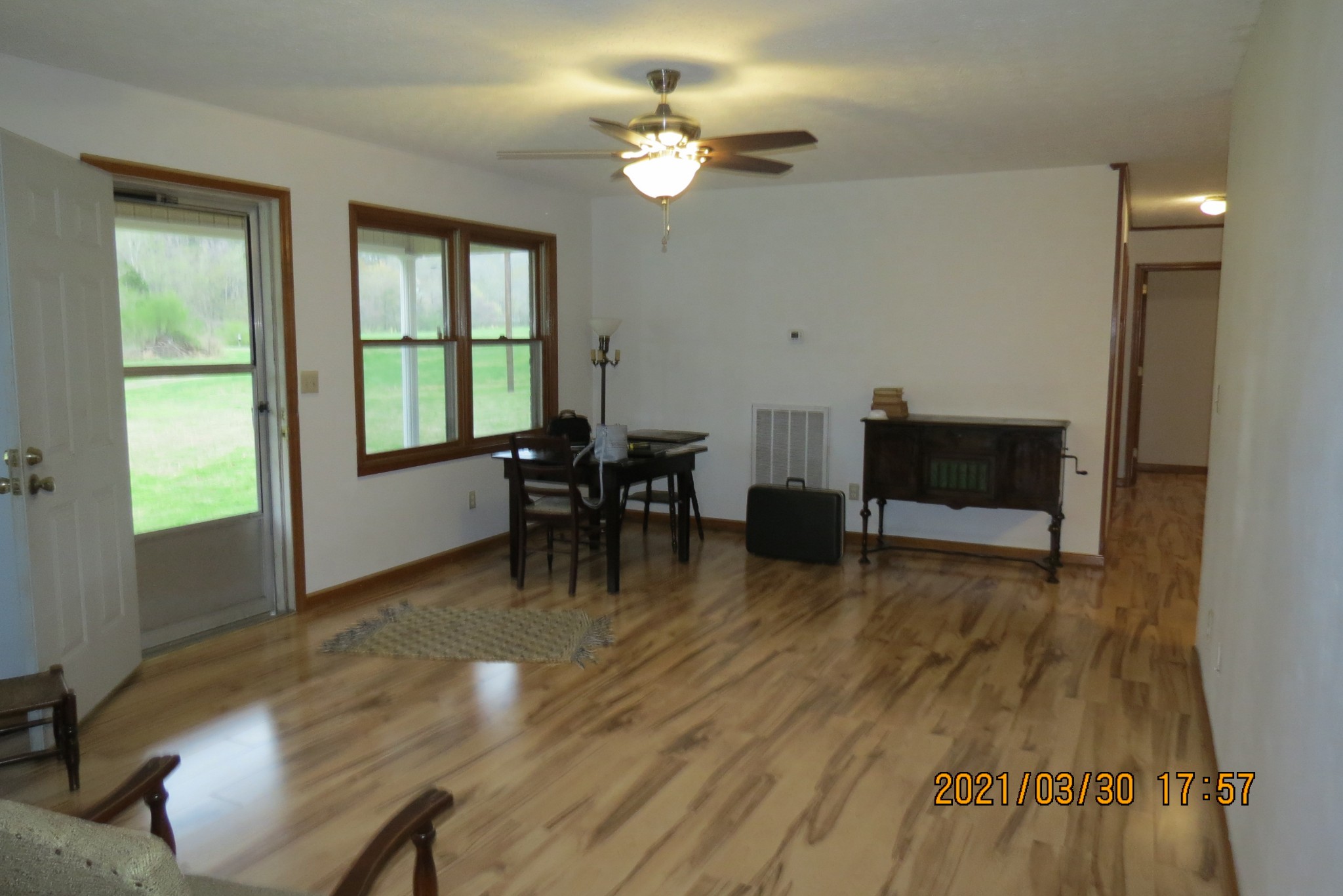 876 Denmark Road Erin, TN 37061 - Photo 13 of 45 a view of a livingroom with furniture window and wooden floor