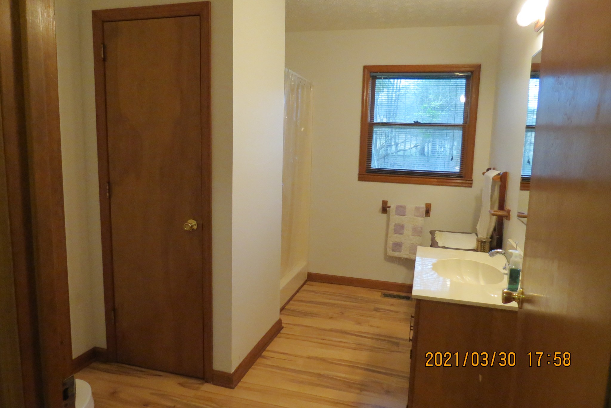 876 Denmark Road Erin, TN 37061 - Photo 14 of 45 a bathroom with a sink and a mirror