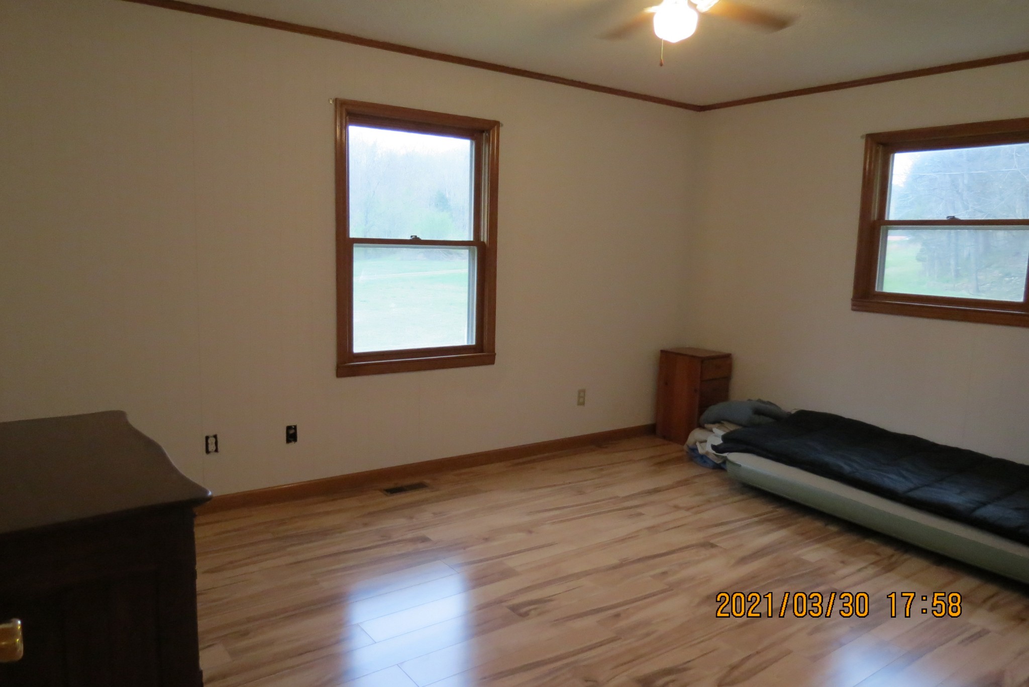 876 Denmark Road Erin, TN 37061 - Photo 15 of 45 a view of an empty room with wooden floor and a window