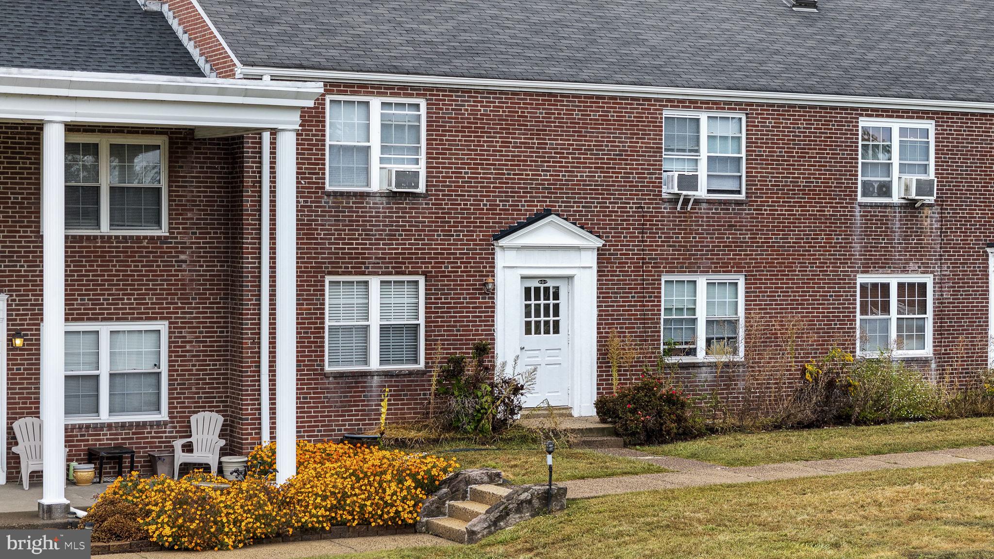 200 Maplewood Drive, Unit D8 Pottstown, PA 19464 - Photo 1 of 12 a front view of a house with a yard