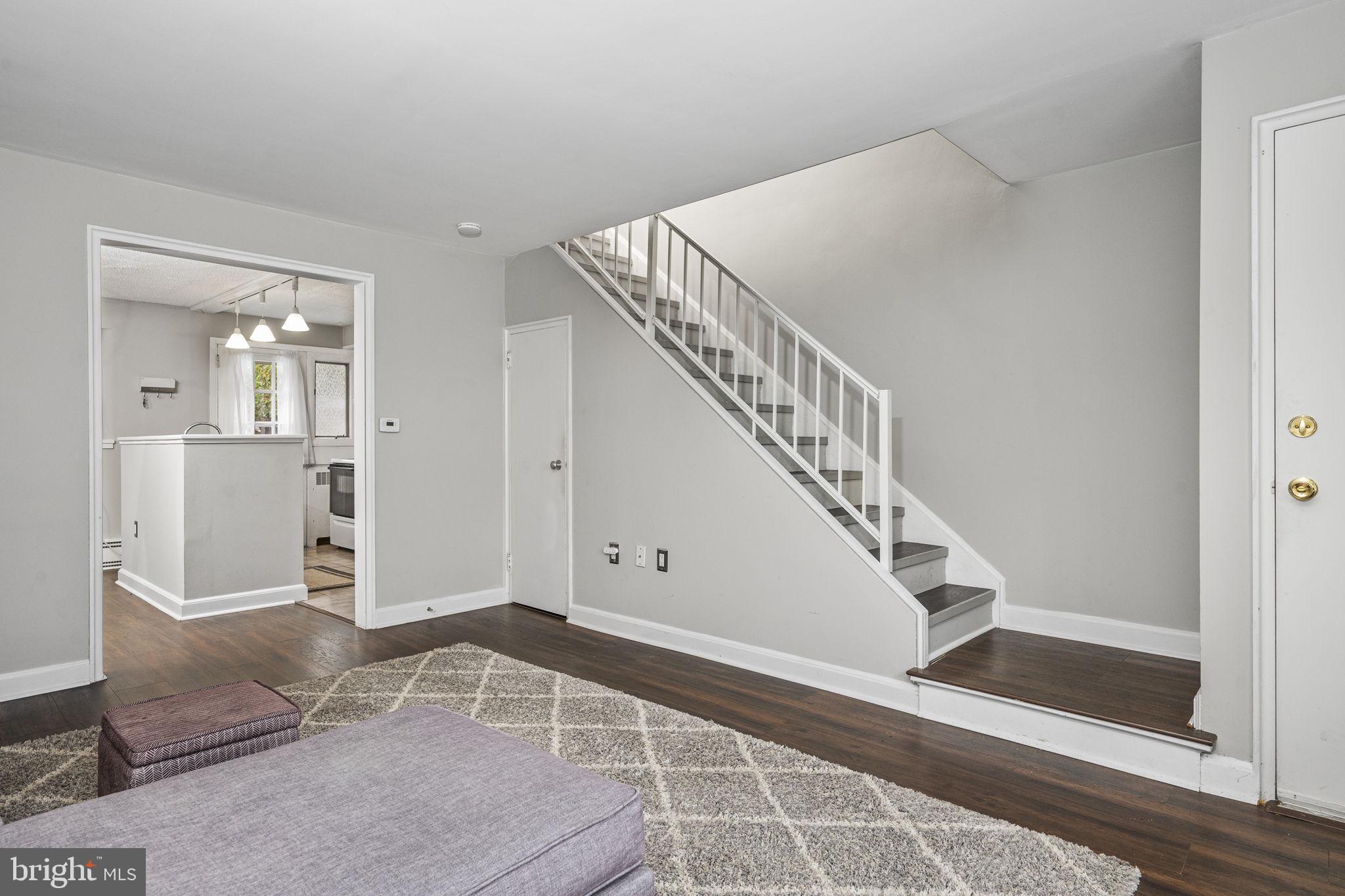 200 Maplewood Drive, Unit D8 Pottstown, PA 19464 - Photo 4 of 12 a view of entryway and hall with wooden floor