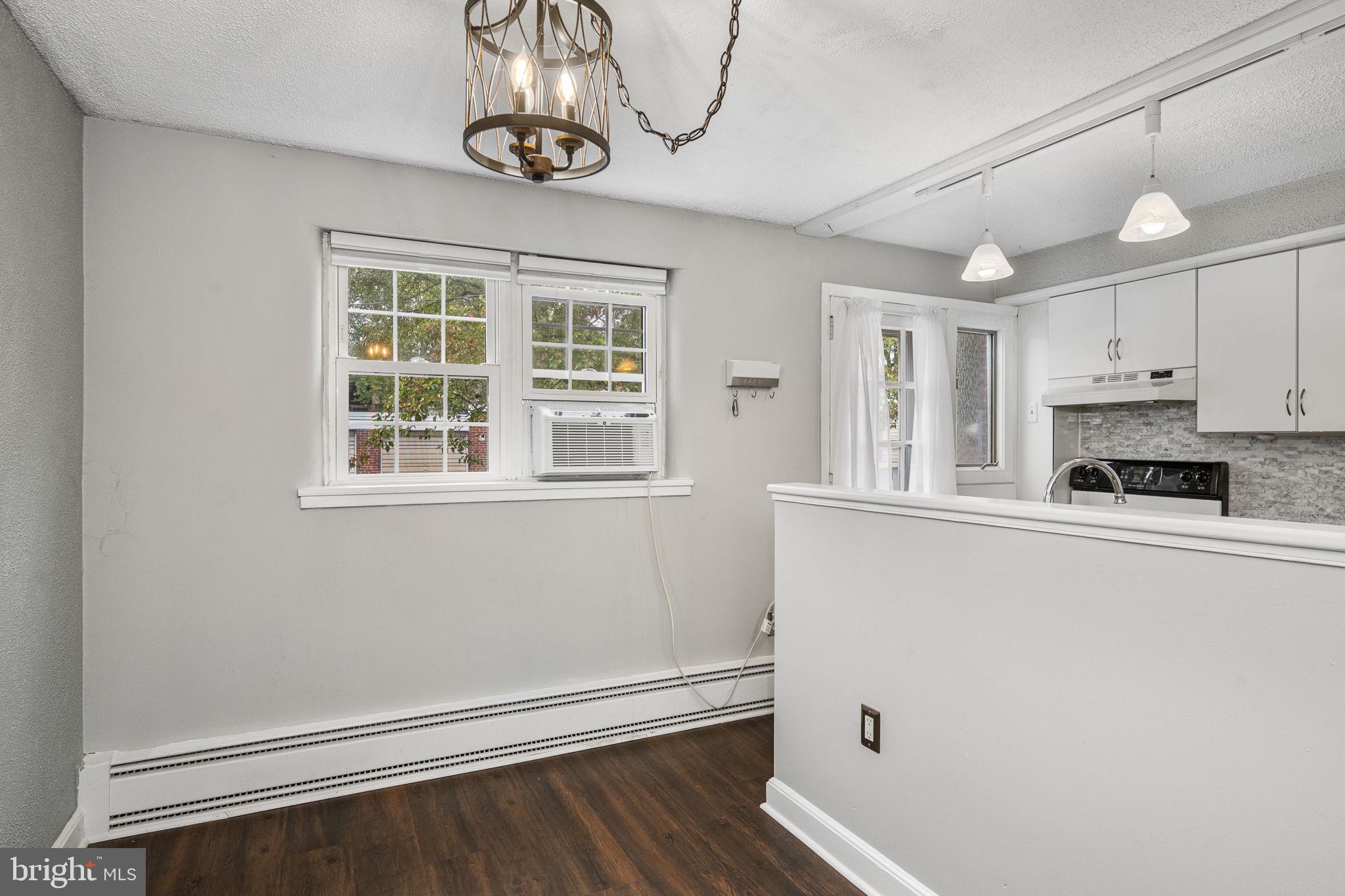 200 Maplewood Drive, Unit D8 Pottstown, PA 19464 - Photo 5 of 12 a view of a kitchen with a dishwasher cabinets and a window