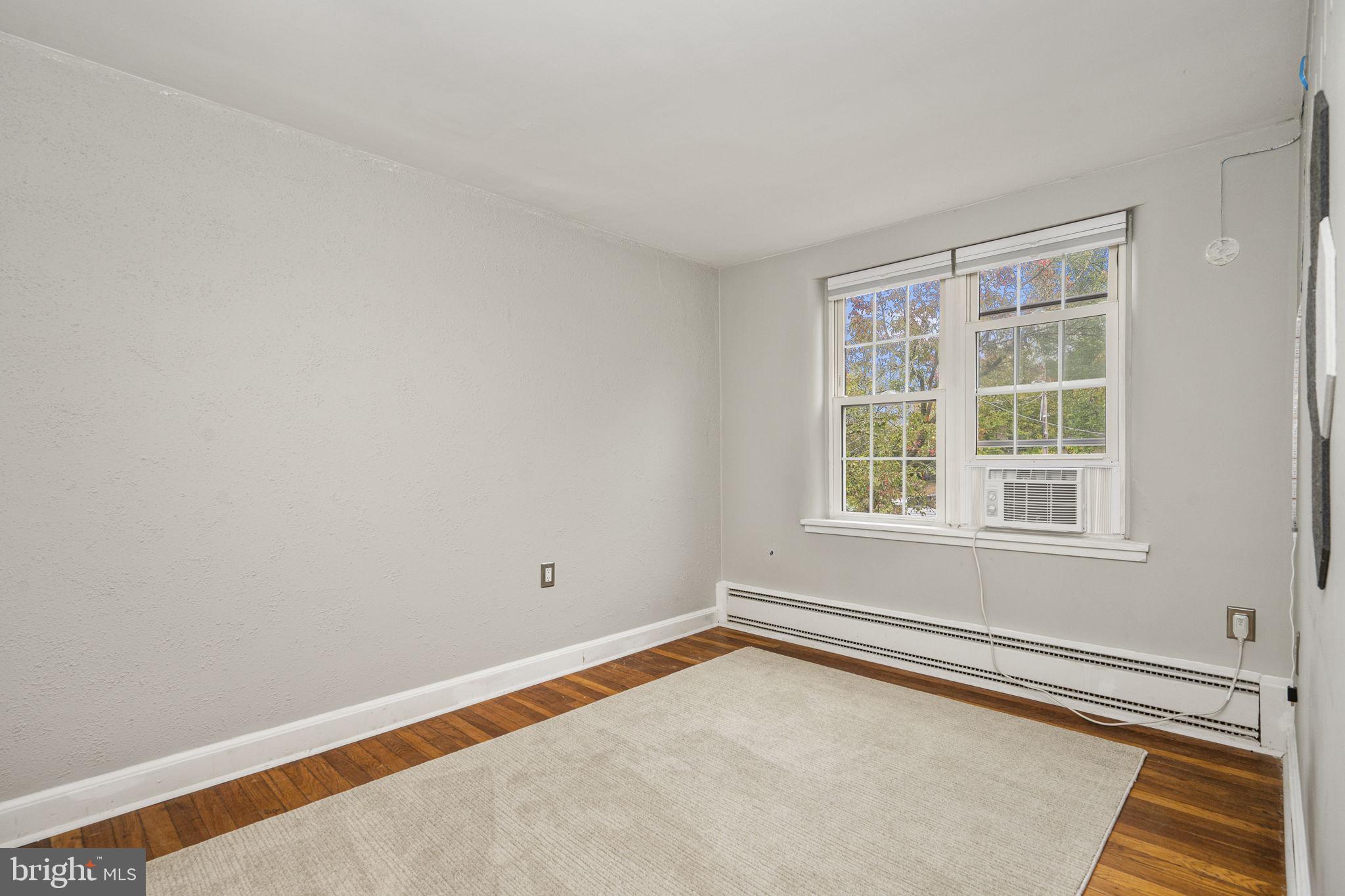 200 Maplewood Drive, Unit D8 Pottstown, PA 19464 - Photo 9 of 12 an empty room with a window