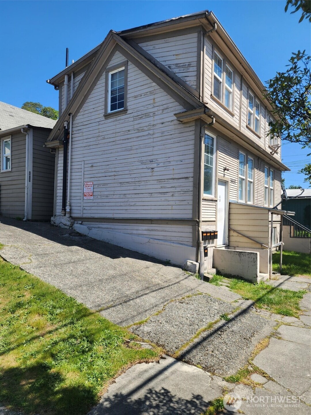 1637 Center Street Tacoma, WA 98409 - Photo 4 of 10 a front view of a house with a yard and garage