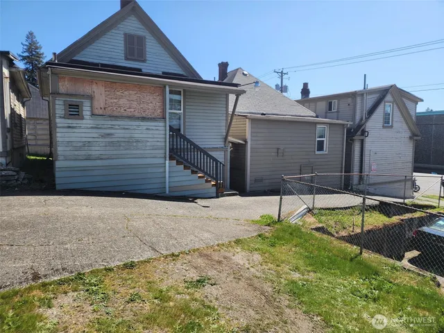 a house that has a small yard and a large window