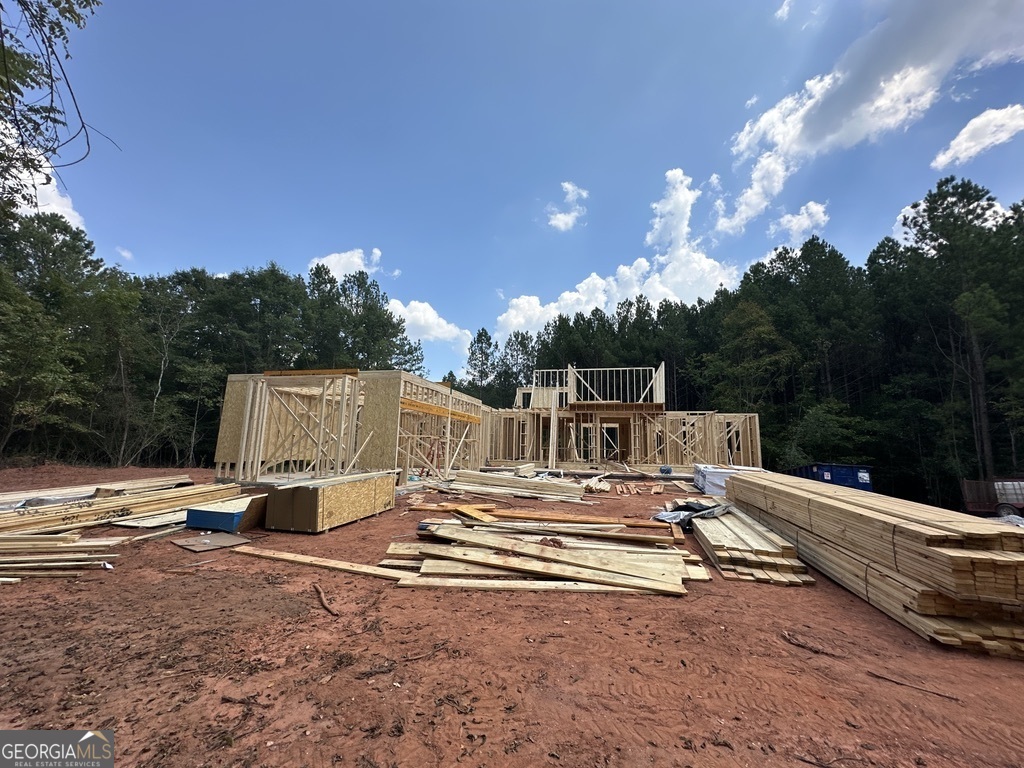 0 Harmony Gates Drive, Unit TRACT 24 Commerce, GA 30530 - Photo 27 of 34 a view of patio with a table and chair a barbeque and swing