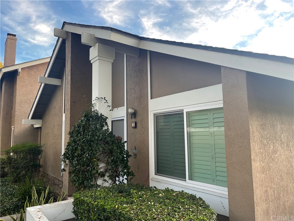 12 Denver, Unit 74 Irvine, CA 92604 - Photo 1 of 1 front view of a house with a plants