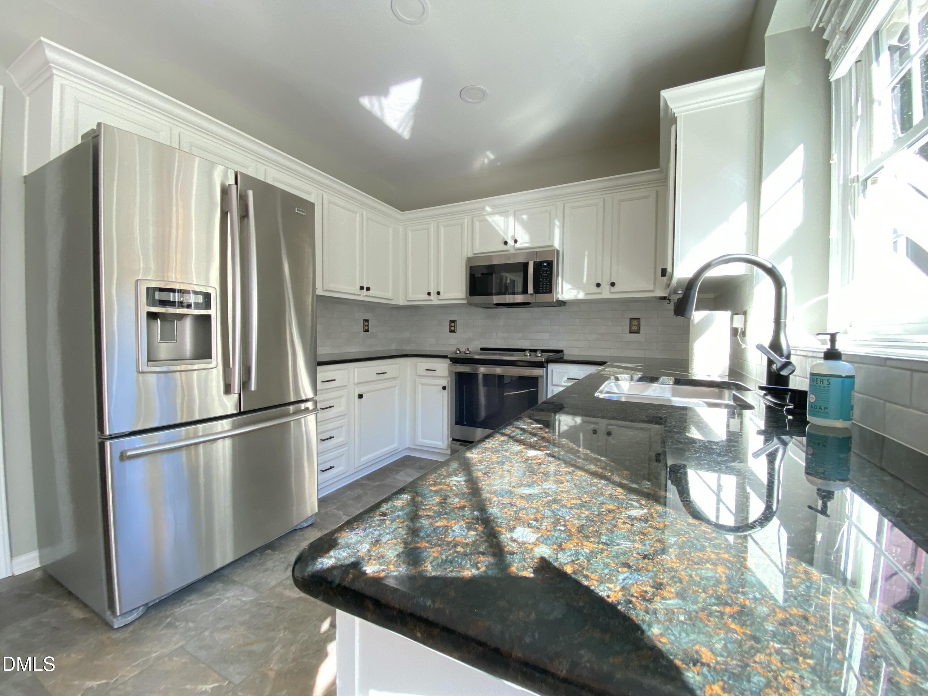 8136 Greywinds Drive Raleigh, NC 27615 - Photo 19 of 49 kitchen