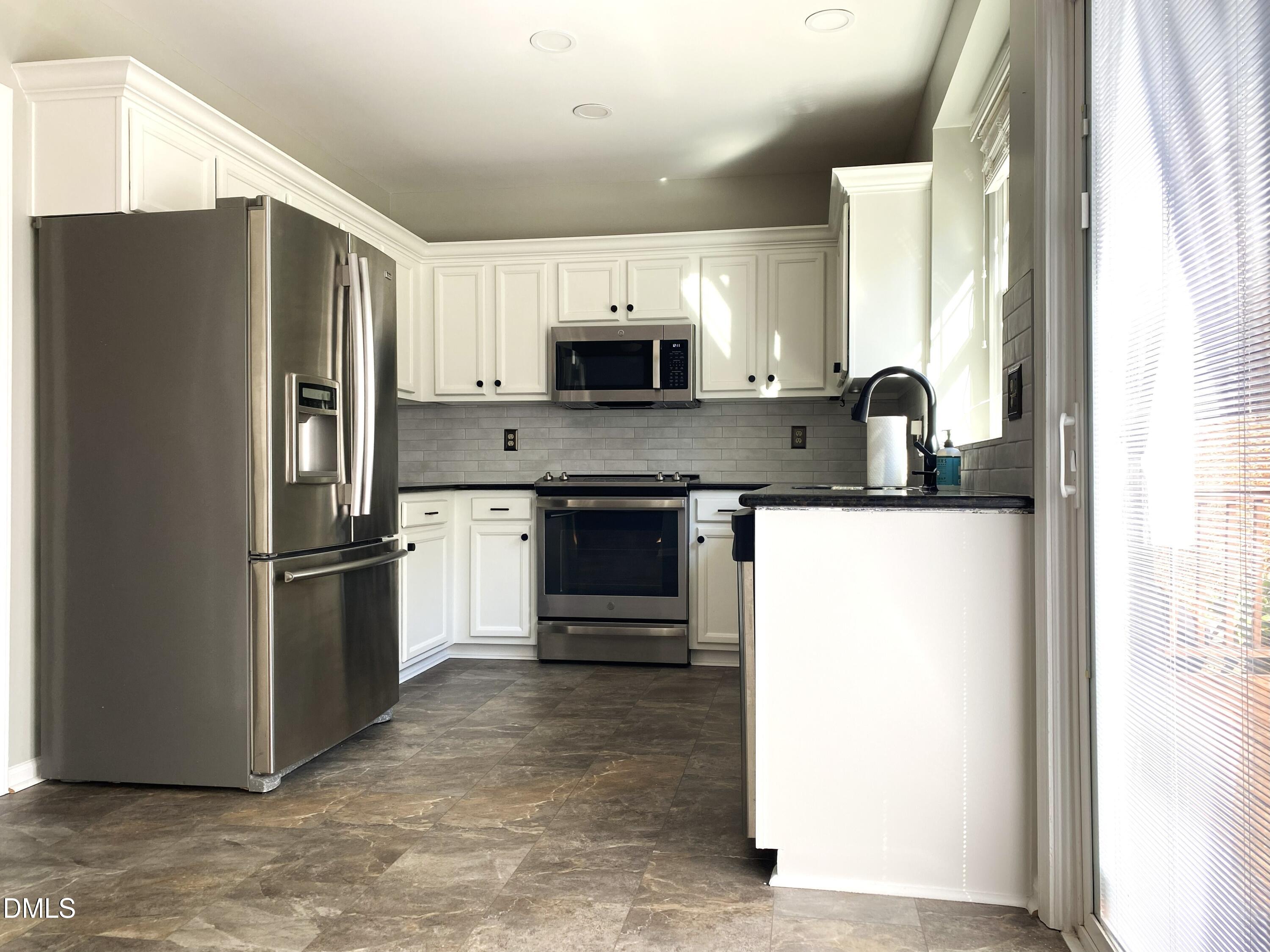 8136 Greywinds Drive Raleigh, NC 27615 - Photo 20 of 49 kitchen