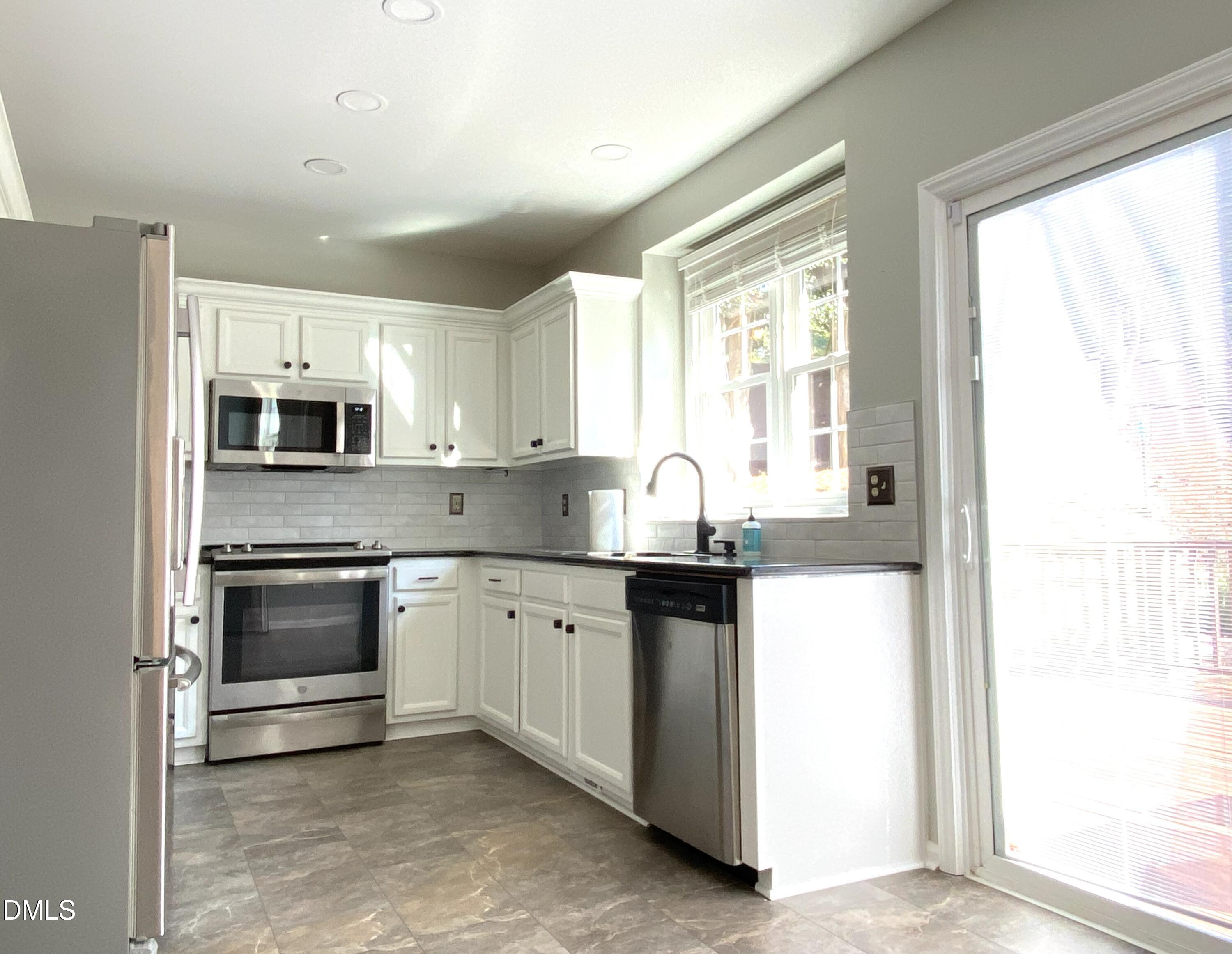 8136 Greywinds Drive Raleigh, NC 27615 - Photo 21 of 49 kitchen