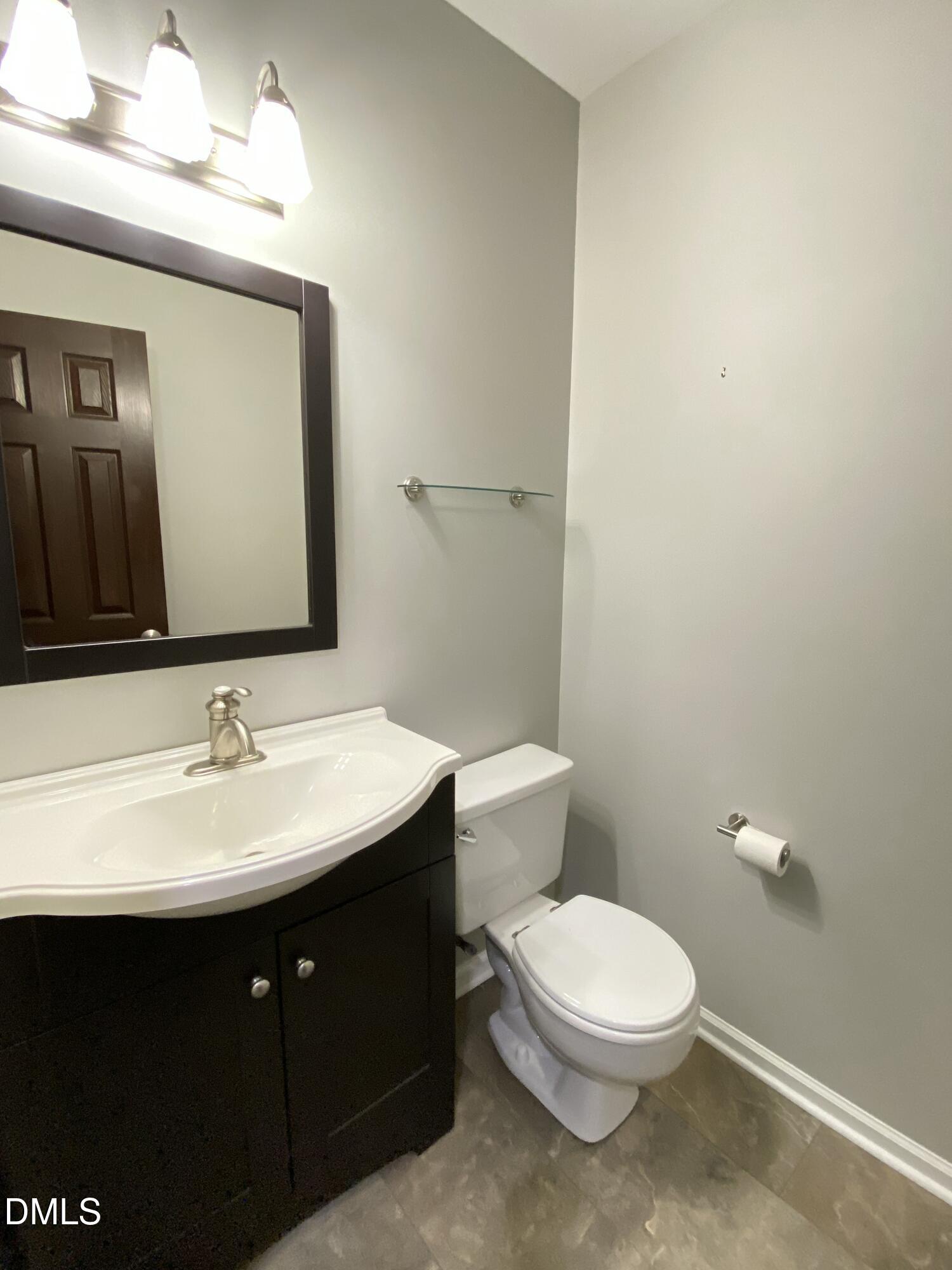 8136 Greywinds Drive Raleigh, NC 27615 - Photo 29 of 49 half bath downstairs