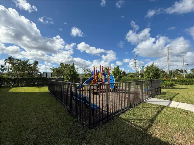 a view of a wrought iron fences in front of house