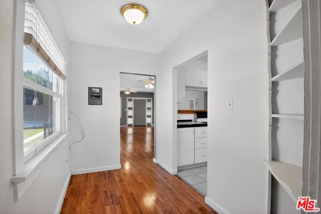 a view of a kitchen from the hallway