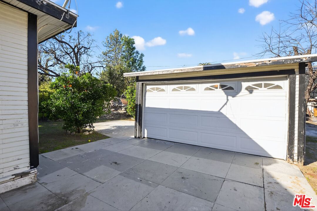 11029 Sarah Street Los Angeles, CA 91602 - Photo 25 of 27 a view of backyard with a small cabin and potted plants