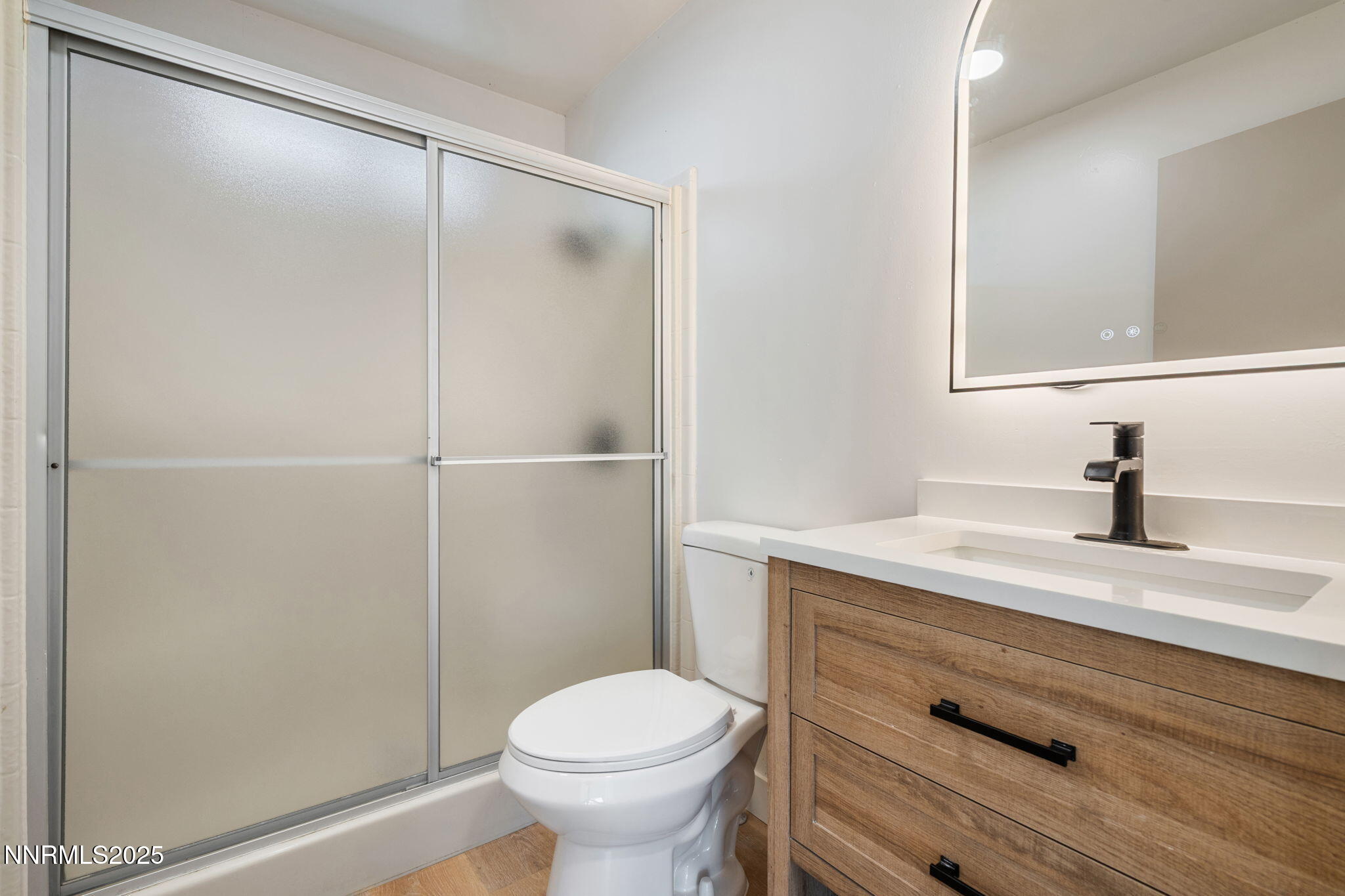 4925 Cheyenne Trail Silver Springs, NV 89429 - Photo 17 of 35 a bathroom with a granite countertop sink toilet and shower