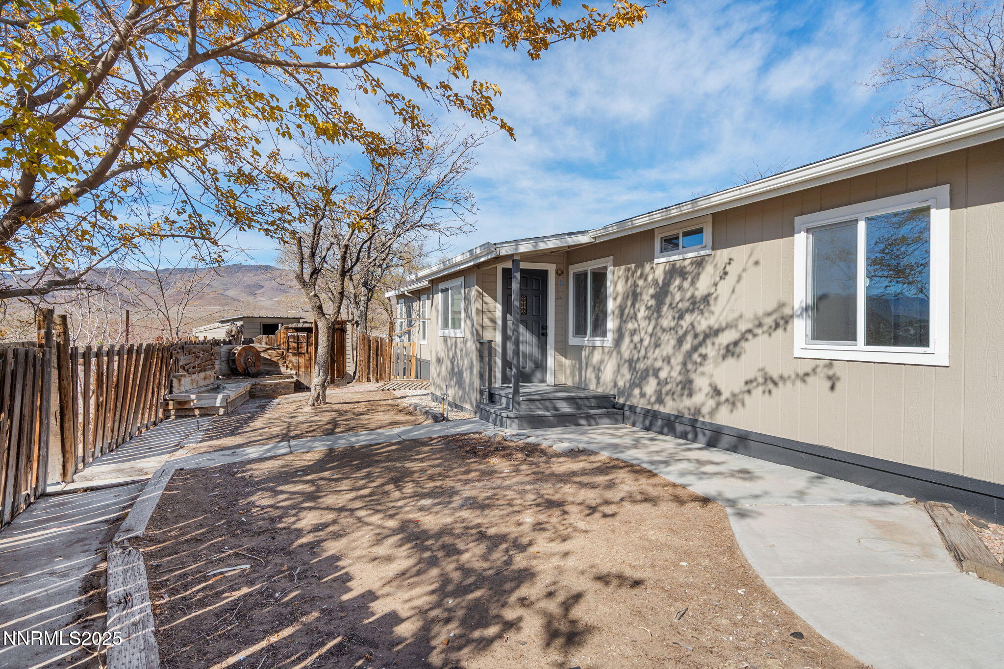 4925 Cheyenne Trail Silver Springs, NV 89429 - Photo 19 of 35 a view of a house with a snow in the yard