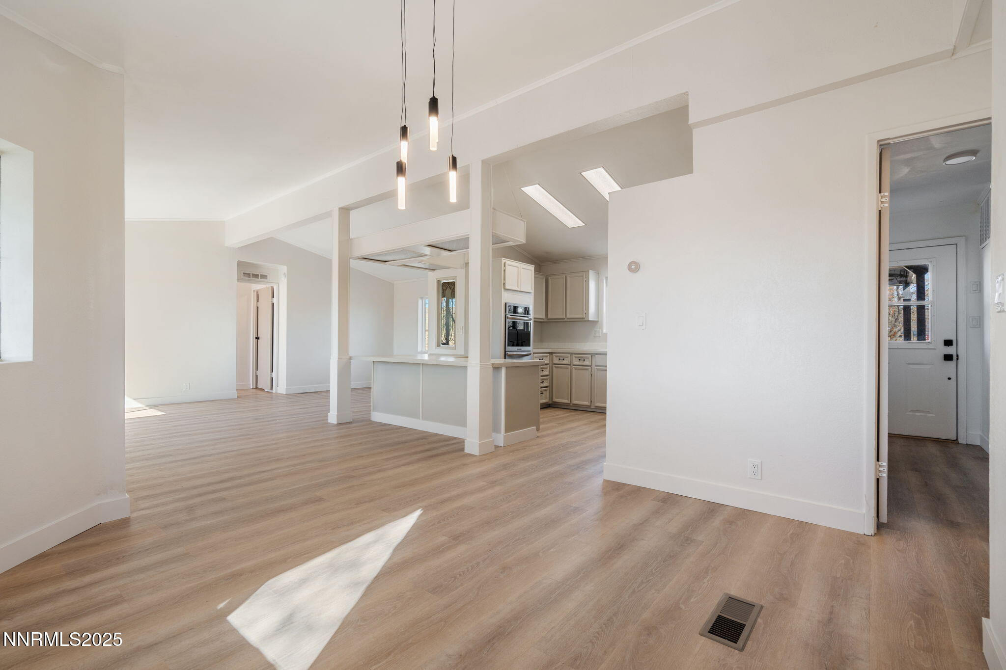 4925 Cheyenne Trail Silver Springs, NV 89429 - Photo 2 of 35 a view of a kitchen with wooden floor and a kitchen