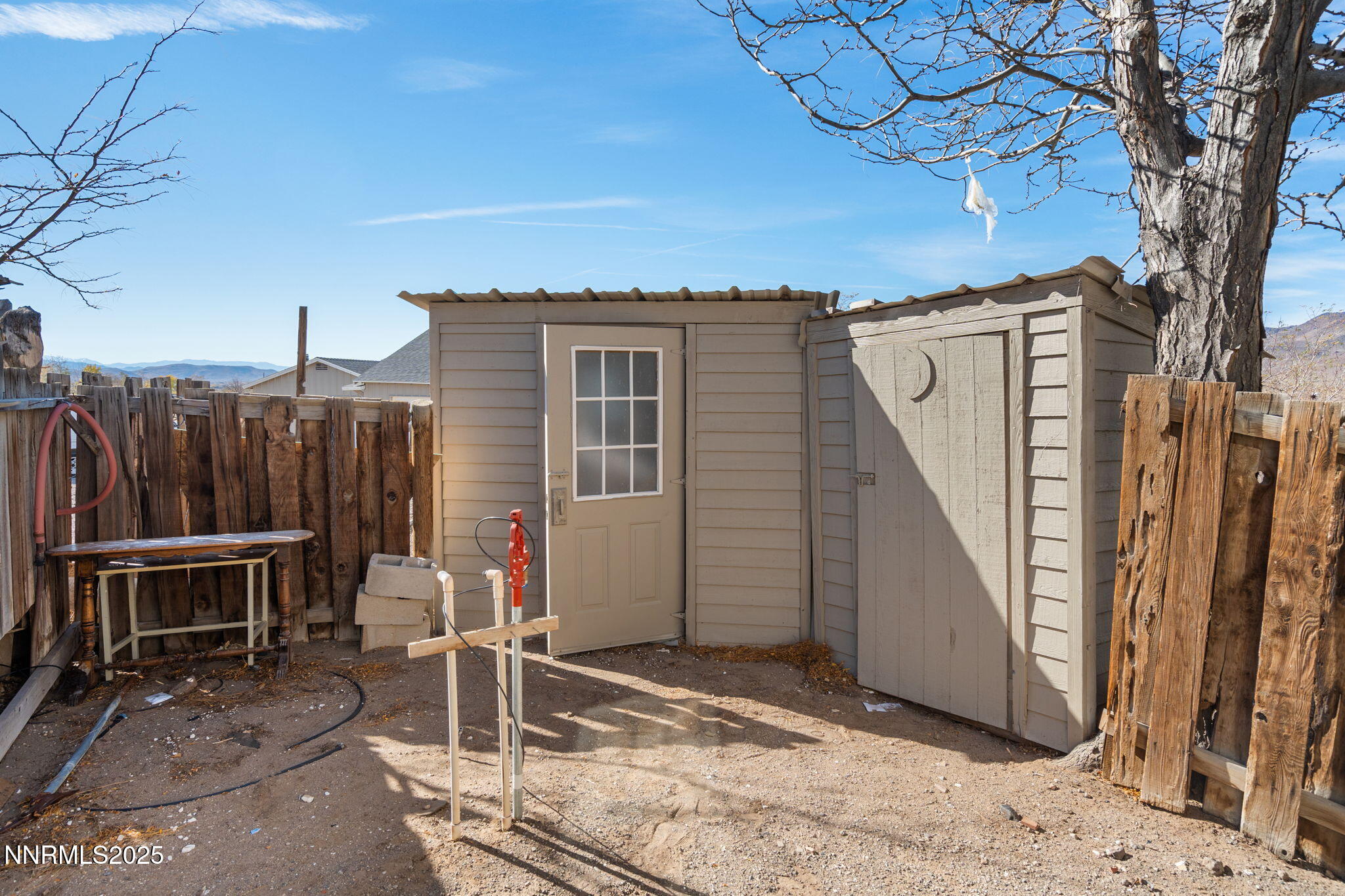4925 Cheyenne Trail Silver Springs, NV 89429 - Photo 22 of 35 a backyard of a house with table and chairs
