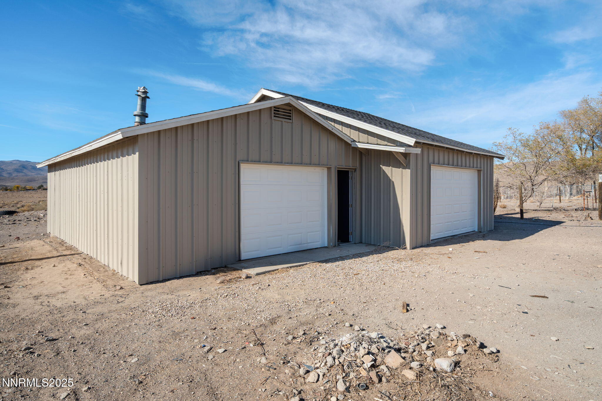 4925 Cheyenne Trail Silver Springs, NV 89429 - Photo 24 of 35 a view of wooden house with a yard