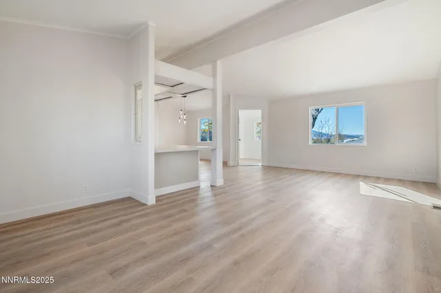 a bathroom with a bathtub and mirror