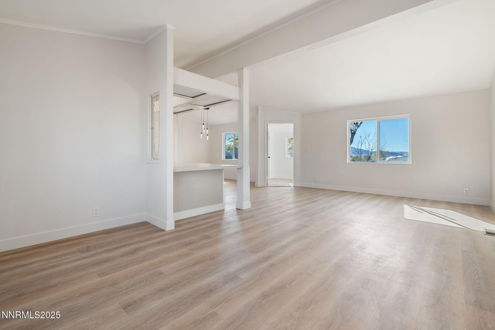 4925 Cheyenne Trail Silver Springs, NV 89429 - Photo 9 of 35 an empty room with wooden floor and a window