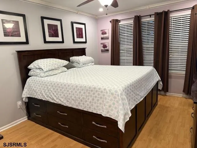 a bedroom with a bed and a night stand