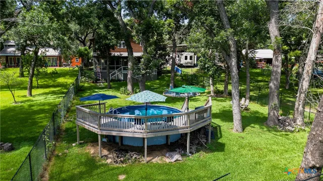 a view of an chairs and table in the garden