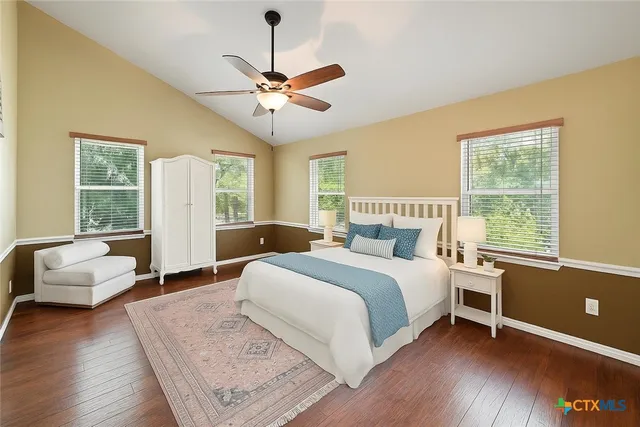 a bedroom with a large bed and a couch