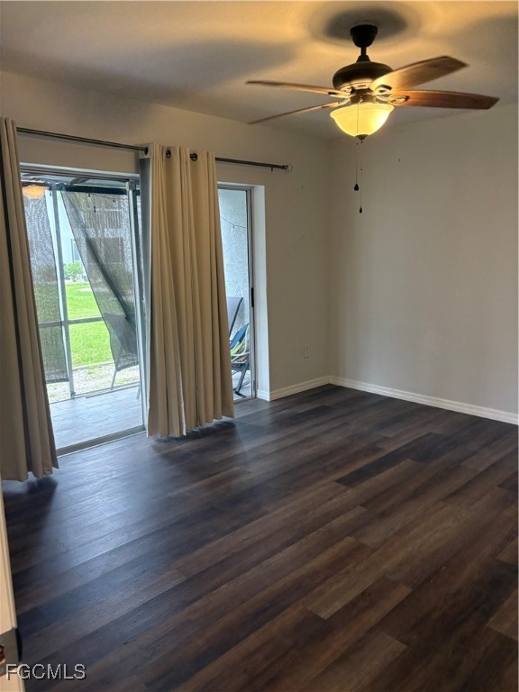 5031 Southwest 16th Place, Unit 101 Cape Coral, FL 33914 - Photo 4 of 10 a view of empty room with wooden floor and fan