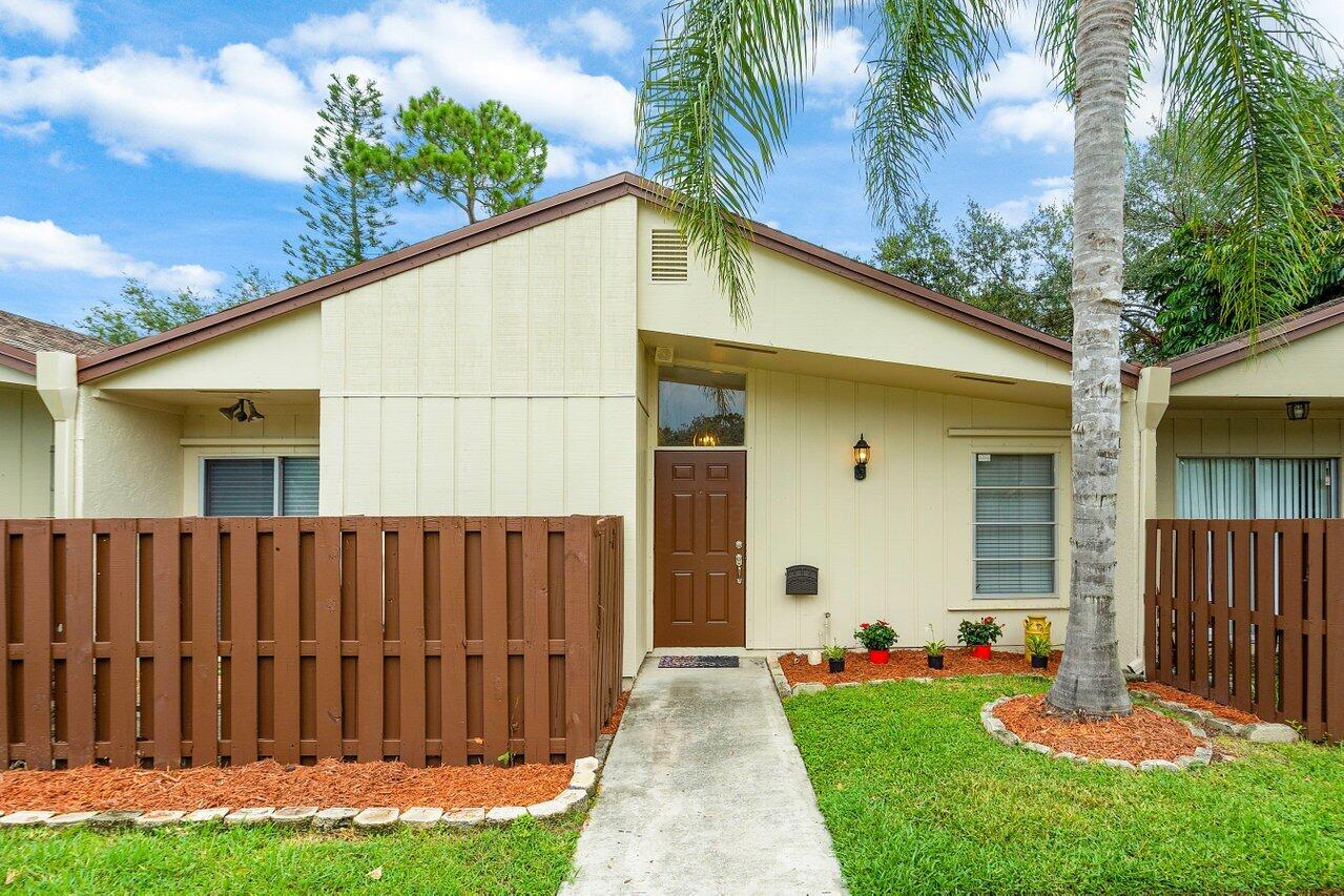 a front view of a house having yard