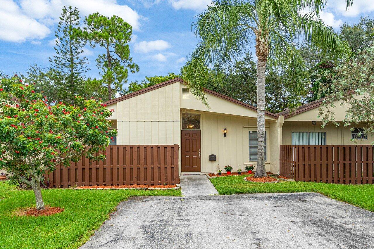 22543 Vistawood Way Boca Raton, FL 33428 - Photo 3 of 32 a view of a house with a yard and a large tree