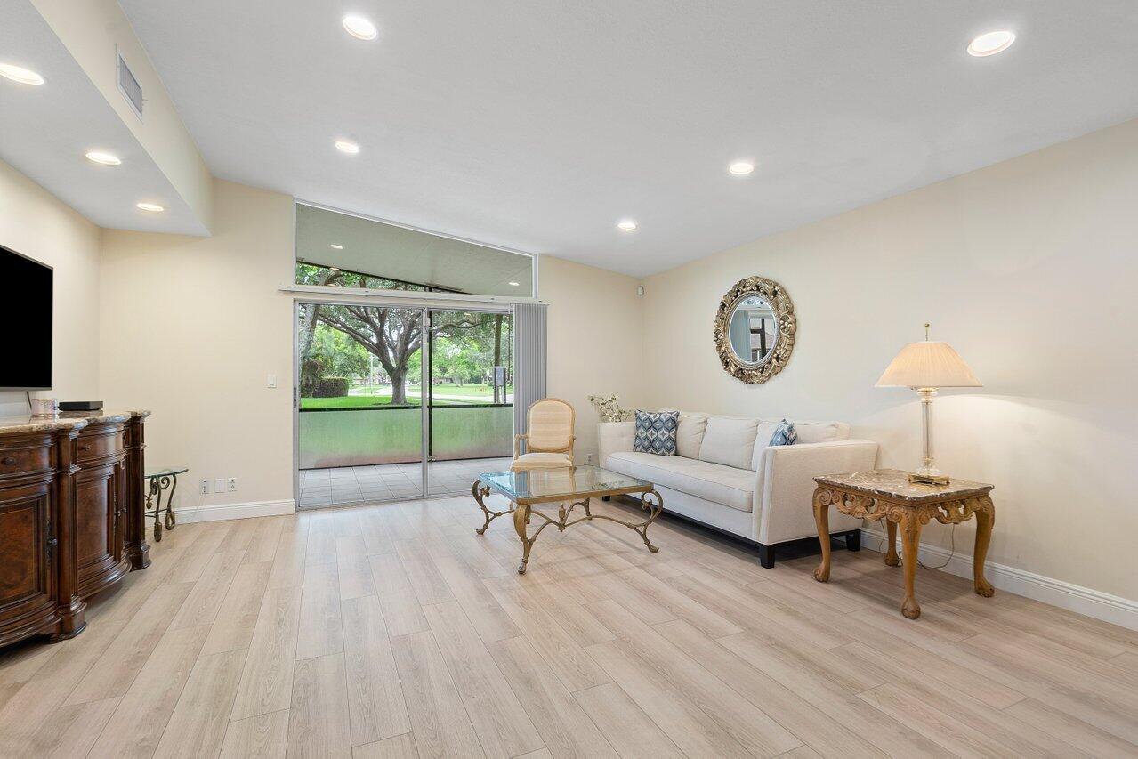 22543 Vistawood Way Boca Raton, FL 33428 - Photo 9 of 32 a living room with furniture and a flat screen tv