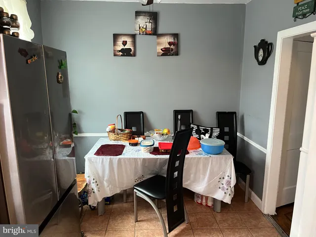 a bed room with a bed a couch and a desk