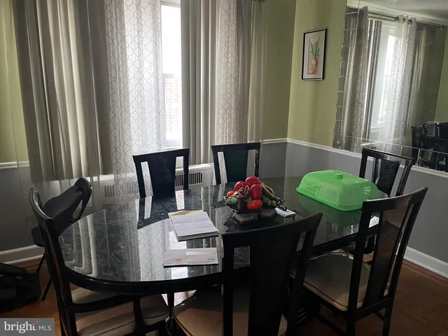 a view of a dining room with furniture and window