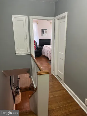 a view of hallway with livingroom and furniture