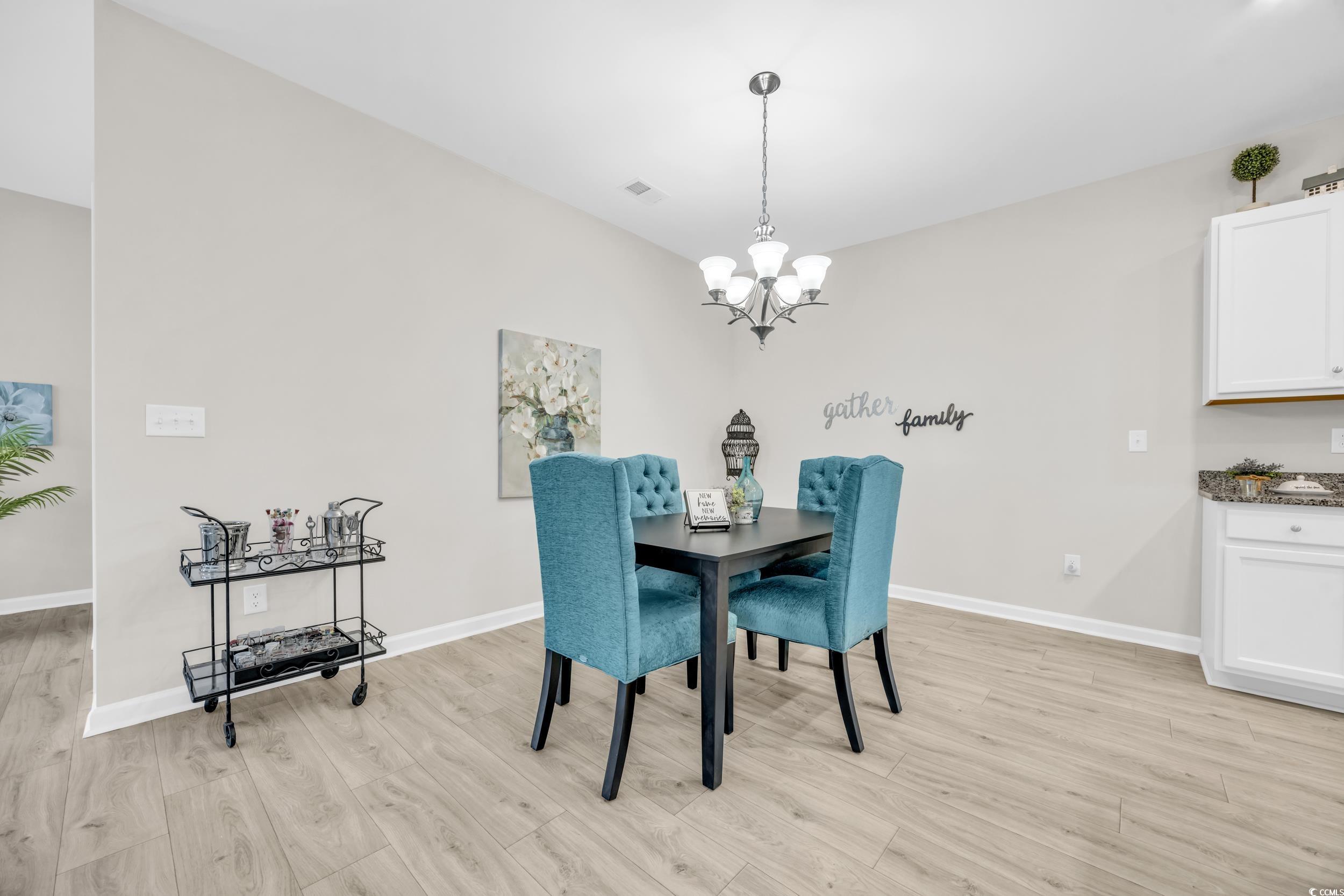 520 Shellbark Drive Longs, SC 29568 - Photo 8 of 26 Dining area with light wood-type flooring and a ch